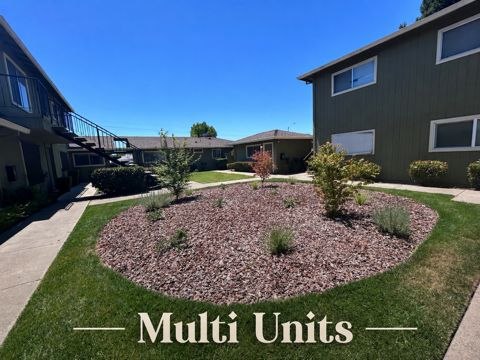 Multi-unit rental property exterior with landscaped courtyard